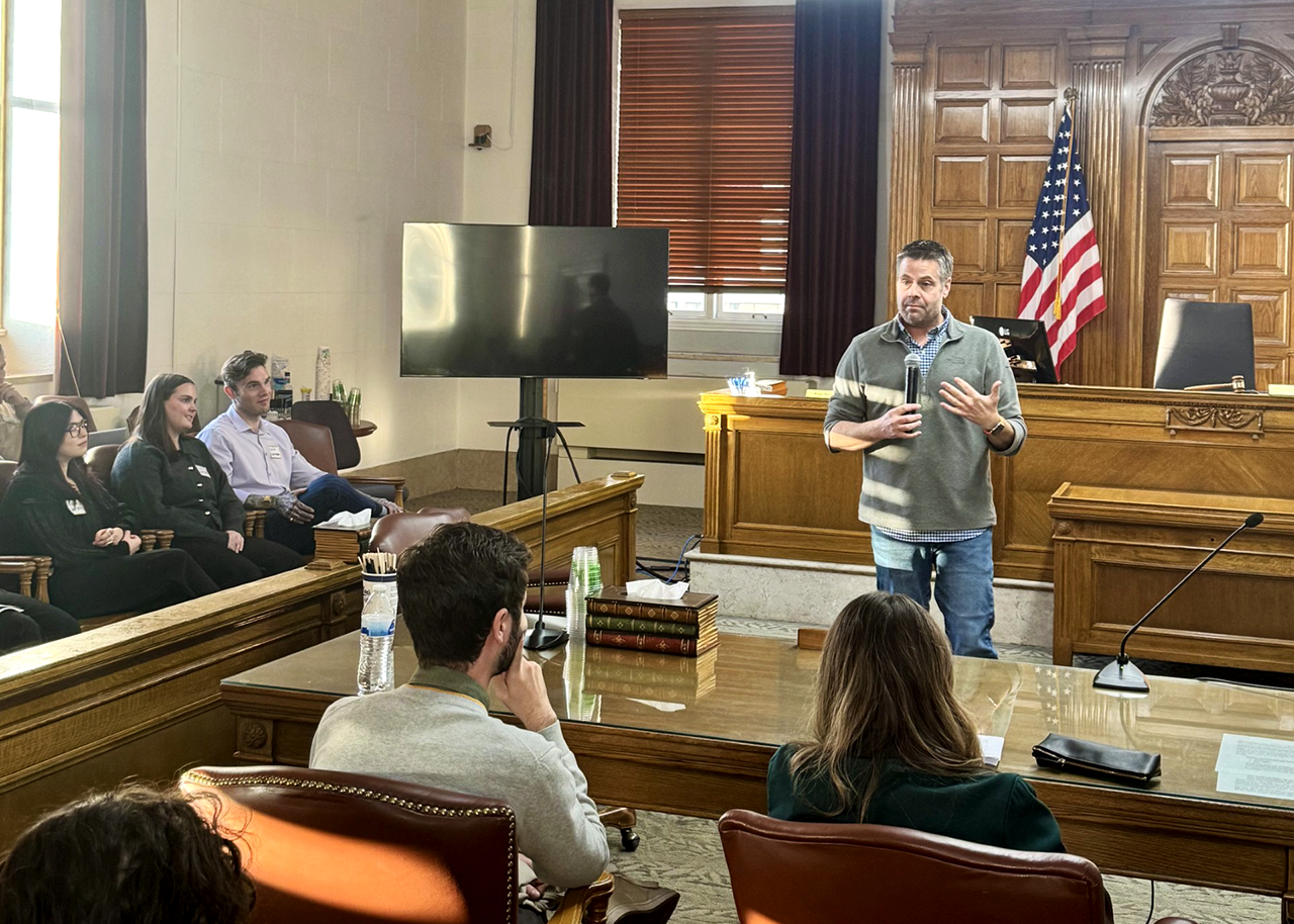 Judge John Olafson presenting to audience